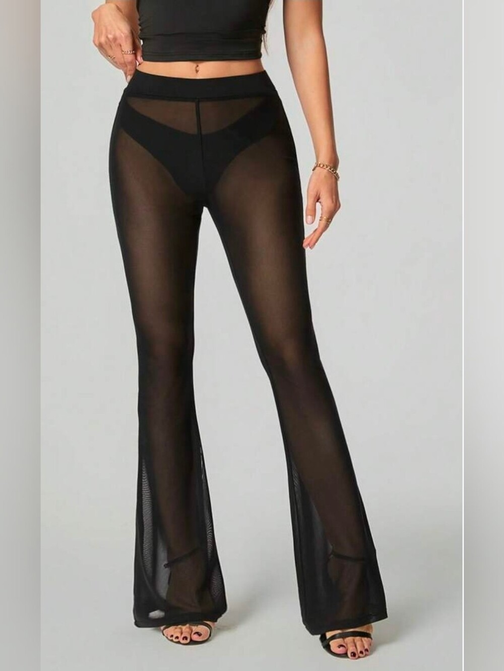 Forever 21 black sheer mesh flare Pants. Size Large